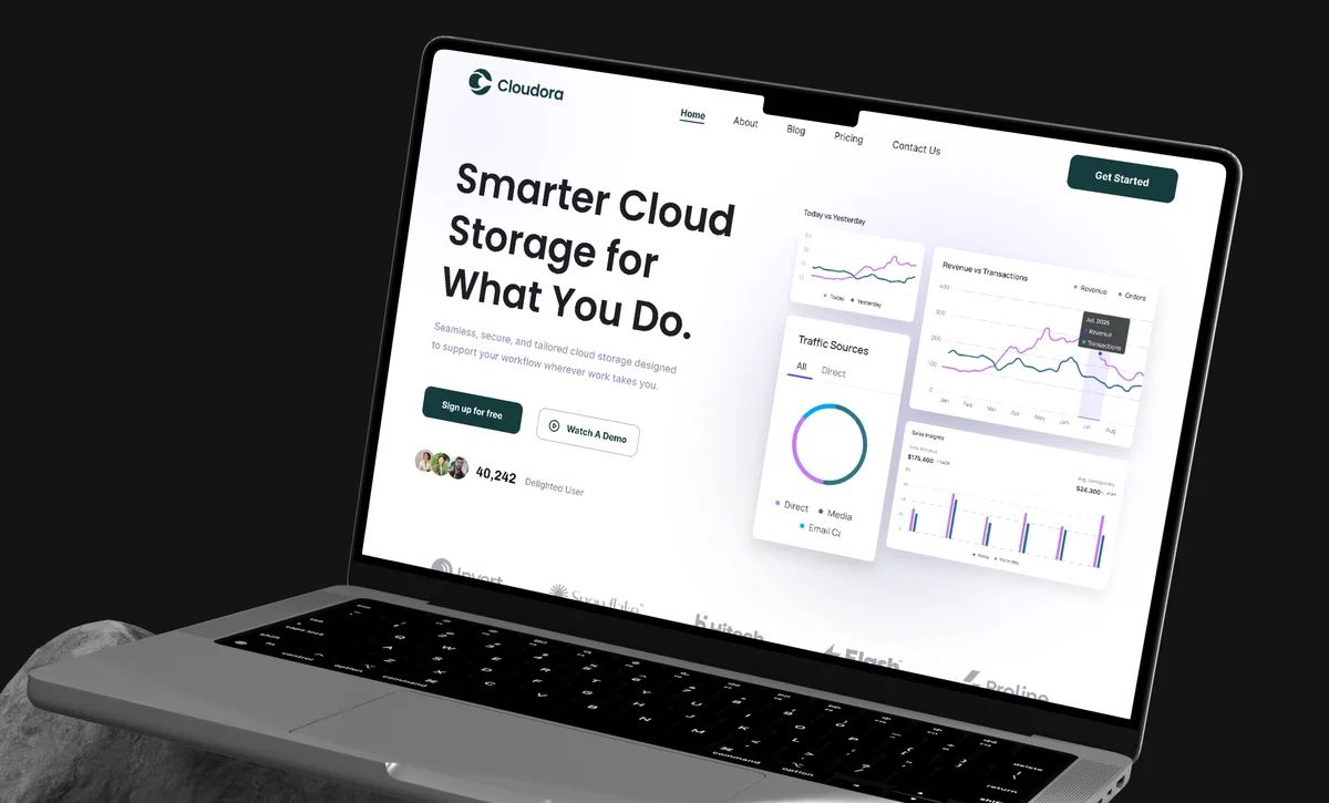Cloudora landing page on a laptop resting on a rock