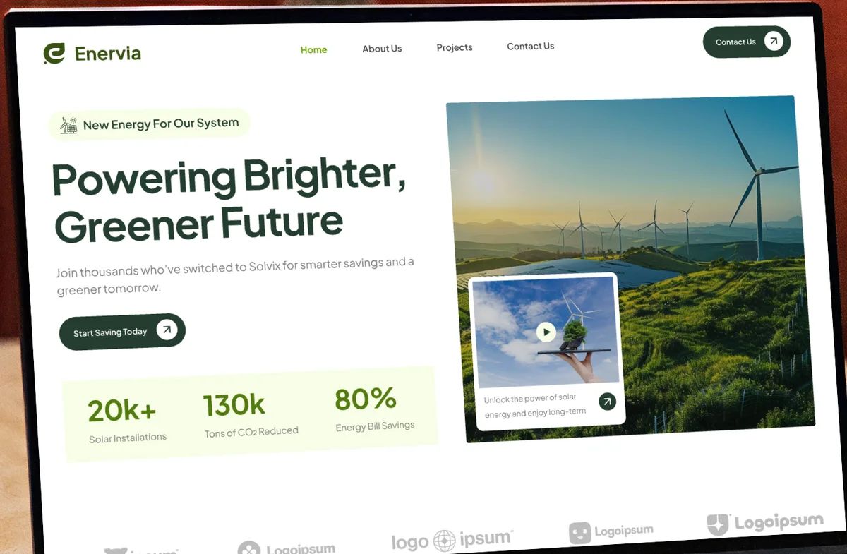 Enervia landing page on a laptop: 'Powering Brighter, Greener Future' hero with wind turbines